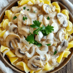 To create the perfect slow cooker creamy mushroom stroganoff, you will need: - 1 pound (450g) mushrooms, sliced (cremini or a mix) - 1 medium onion, diced - 3 cloves garlic, minced - 1 cup vegetable broth - 1 tablespoon soy sauce - 1 teaspoon dried thyme - 1 teaspoon paprika - 1 cup sour cream - 2 tablespoons cornstarch mixed with 2 tablespoons water - Salt and pepper to taste - 8 ounces (225g) egg noodles - Fresh parsley, chopped These main ingredients bring a rich, umami flavor to your dish. The mushrooms and broth create a deep base, while the sour cream adds a creamy finish. Want to take your stroganoff to the next level? Try these optional ingredients: - 1 tablespoon Worcestershire sauce for a tangy kick - 1 cup of fresh spinach for extra color and nutrition - A splash of white wine for depth of flavor - A sprinkle of nutmeg for warmth Adding these ingredients can enhance the taste and give your dish a unique twist. Garnishes add a fun touch and a burst of color. Here are some suggestions: - Freshly chopped parsley adds brightness - A dollop of sour cream for extra creaminess - A few slices of sautéed mushrooms on top - Cracked black pepper for a bit of spice These garnishes make your stroganoff look appealing and taste even better. Enjoy creating a dish that is not only comforting but also beautiful! Start by getting your slow cooker ready. Add the sliced mushrooms, diced onion, and minced garlic to the pot. This mix gives the stroganoff a great base. Now, pour in the vegetable broth and soy sauce. These add depth and flavor. Sprinkle in the dried thyme and paprika. These spices bring warmth to the dish. Stir everything gently so it mixes well. Now it's time to cook! Secure the lid on your slow cooker. Set it to low heat for about 6-7 hours. This slow cooking helps the mushrooms become soft and tasty. If you're in a hurry, you can set it to high for 3-4 hours. Just remember, low heat gives the best flavor. About 30 minutes before serving, add the sour cream to the mix. This makes the dish rich and creamy. In a small bowl, mix the cornstarch and water until smooth. This is your thickening agent. Pour it into the slow cooker and stir well. Cover the pot again to let it thicken. As the stroganoff cooks, boil a pot of salted water for the egg noodles. Cook them according to the package notes until they are al dente. Drain the noodles and set them aside. Finally, taste the stroganoff and add salt and pepper to your liking. Serve it over the noodles, and garnish with fresh parsley for color. Enjoy this creamy, comforting dish! To boost the flavor of your stroganoff, try these simple tips: - Use fresh herbs. They add bright taste. - Add a splash of white wine for depth. - Mix in a spoon of Dijon mustard for zing. - Experiment with different mushrooms. Shiitake or portobello can add unique flavors. These small changes can make a big difference. They transform your dish into a gourmet delight. Here are some mistakes to watch out for: - Don't skip the browning. Sauté mushrooms and onions before adding. This adds a rich taste. - Avoid cooking too fast. Low heat is key for tender mushrooms. - Don't forget to season. Taste your dish before serving. Adjust salt and pepper as needed. By avoiding these pitfalls, your stroganoff will shine. The right tools can make cooking easier. Here’s what I recommend: - A slow cooker for even cooking. - A sturdy cutting board and knife for prep. - A mixing bowl for the cornstarch slurry. - A pot for boiling egg noodles. Having the right equipment will ensure smooth cooking and delightful results. {{image_4}} You can easily make this dish vegetarian or vegan. Replace sour cream with coconut cream or cashew cream. Use vegetable broth instead of any meat stock. Also, you can use a soy sauce or tamari for flavor. These changes keep the dish rich and creamy. For a gluten-free version, swap egg noodles for gluten-free pasta. Brown rice or quinoa can also work well. Just make sure to check that your soy sauce is gluten-free. This way, you still enjoy a tasty meal without the gluten. Feel free to experiment with different mushrooms. Shiitake, portobello, or even oyster mushrooms add unique flavors. If you want more texture, try adding spinach or kale. You can also swap spices, like using Italian herbs instead of thyme. This keeps your stroganoff fresh and exciting every time! Storing leftovers of slow cooker creamy mushroom stroganoff is easy. First, let the dish cool to room temperature. Then, place it in an airtight container. Make sure to cover it well to keep out air. This helps keep the flavors fresh. Store the container in the fridge for up to four days. When you're ready to enjoy your stroganoff again, reheating is simple. You can use either a microwave or a stovetop. For the microwave, place a serving in a bowl. Cover it with a lid or a damp paper towel. Heat for 1-2 minutes. Stir halfway to ensure even heating. If using the stovetop, add the stroganoff to a pan over low heat. Stir gently until hot. Add a splash of broth or water if it seems too thick. Freezing is a great option for longer storage. To freeze, let the stroganoff cool completely. Then, scoop it into freezer-safe bags or containers. Leave some space at the top to allow for expansion. Label the bags with the date. You can freeze the stroganoff for up to three months. When you're ready to eat, thaw it in the fridge overnight. Reheat it as mentioned above for best results. Yes, you can use various pasta types. While egg noodles work best, you can try fettuccine or penne. Whole wheat or gluten-free pasta also works well. Just follow the cooking time on the package for the pasta you choose. Each type will give a unique texture to your stroganoff. The stroganoff stays good in the fridge for about 3-4 days. Make sure to store it in an airtight container. This way, you can enjoy leftovers without worry. Reheat it on the stove or in the microwave. Just add a splash of water or broth to keep it creamy. Absolutely! You can add cooked chicken, beef, or pork to the stroganoff. Simply cook the meat before adding it to the slow cooker. This adds protein and makes the dish heartier. Just remember to adjust the cooking time if your meat is still raw, so it cooks through properly. This blog post covered how to make an amazing stroganoff. We talked about key ingredients, cooking steps, and tips to avoid mistakes. You learned about variations for different diets and how to store leftovers. In summary, cooking stroganoff can be simple and fun. Just follow the steps and make it your own. Enjoy your meal, and share it with others!