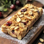 To make Cherry Almond Granola Bars, gather the following ingredients: - 2 cups rolled oats - 1 cup almonds, roughly chopped - 1 cup dried cherries, chopped if large - 1/2 cup honey or maple syrup - 1/4 cup almond butter - 1/2 teaspoon vanilla extract - 1/2 teaspoon ground cinnamon - 1/4 teaspoon salt - 1/4 cup sliced almonds (for topping) These simple ingredients combine to create a tasty and healthy snack. Each granola bar is packed with nutrients. Here is a rough breakdown: - Calories: 150 - Protein: 4 grams - Carbohydrates: 20 grams - Fats: 7 grams - Fiber: 2 grams These bars offer a good balance of energy, protein, and healthy fats. They are perfect for a quick snack or breakfast on the go. If you have allergies, there are great options: - Nuts: Use sunflower seeds or pumpkin seeds instead of almonds. - Sweeteners: Swap honey for agave syrup for a vegan option. - Fruits: Replace dried cherries with raisins or dried cranberries. - Nut Butters: Use sunflower seed butter if almond butter is not safe. These substitutes keep the bars tasty and safe for everyone. Enjoy experimenting with different flavors! To make your Cherry Almond Granola Bars, you need to gather your ingredients. You will need rolled oats, almonds, dried cherries, honey or maple syrup, almond butter, vanilla extract, ground cinnamon, salt, and sliced almonds. This recipe takes about 15 minutes to prepare. 1. Start by preheating your oven to 350°F (175°C). Take an 8x8 inch baking dish and line it with parchment paper. Leave some paper hanging over the edges. This makes it easy to lift the bars out later. 2. In a large mixing bowl, combine 2 cups of rolled oats, 1 cup of roughly chopped almonds, and 1 cup of dried cherries. Add 1/2 teaspoon of ground cinnamon and 1/4 teaspoon of salt. Mix these dry ingredients well. 3. In a small saucepan, heat 1/2 cup of honey (or maple syrup) and 1/4 cup of almond butter over low heat. Stir until the mix is smooth. Take it off the heat and add 1/2 teaspoon of vanilla extract. Mix well. 4. Pour the warm almond butter mixture over your dry ingredients. Stir everything until the oats and nuts are coated. Make sure every bit is sticky and blended well. 5. Move the mixture to the lined baking dish. Press it down firmly into an even layer. Sprinkle 1/4 cup of sliced almonds on top and press them in lightly. Bake your bars in the oven for 20 to 25 minutes. Watch for the edges to turn golden brown. Once they are done, remove them from the oven. Let them cool in the pan for about 10 minutes. After that, use the parchment paper to lift the granola out of the pan. Place it on a wire rack to cool completely. When cool, slice into 16 bars. Enjoy your tasty snack! To make the best cherry almond granola bars, use fresh ingredients. Old oats or nuts can affect the taste. Measure your ingredients carefully for consistency. Mixing the dry ingredients well ensures even flavor. Warm the honey and almond butter enough to blend easily. This will help all the ingredients stick together nicely. Press the mixture firmly into the baking dish. This step helps the bars hold their shape after baking. One common mistake is not pressing down the mixture firmly. If you don’t compact it, the bars may crumble easily. Another mistake is overbaking. Keep an eye on them and remove them when they are golden brown. If you add too many dried cherries, the bars may become too sticky. Balance is key in this recipe. For chewy granola bars, ensure you don’t overbake them. The edges should be golden, but the middle can be slightly soft. The mixture needs enough moisture, so don’t skimp on the almond butter or honey. When cooling, let them rest before slicing. This helps set the bars. For a crunchy texture, bake them a little longer but watch closely. {{image_4}} You can mix flavors to change up your Cherry Almond Granola Bars. Here are some fun ideas: - Chocolate Cherry: Add 1 cup of dark chocolate chips. The chocolate pairs well with cherries. - Peanut Butter Banana: Swap almond butter for peanut butter and add 1 ripe banana. This gives a nice, sweet twist. - Coconut Almond: Stir in 1/2 cup of shredded coconut for a tropical vibe. The coconut adds a chewy texture. Making healthier choices is easy with these substitutions: - Sweeteners: Use agave syrup or coconut sugar instead of honey. Each option has a unique taste. - Oils: Replace almond butter with tahini or sunflower seed butter if you need nut-free bars. - Fruits: Try using dried apricots or cranberries in place of cherries. Each fruit offers a different flavor. Using seasonal ingredients can enhance your bars: - Spring: Add fresh strawberries or diced peaches for a burst of flavor. - Summer: Incorporate blueberries or raspberries when they are at their peak freshness. - Fall: Use dried apples and a pinch of nutmeg for a cozy, autumn taste. You can easily adapt these ideas to your taste. Enjoy mixing and matching! To keep your Cherry Almond Granola Bars fresh, store them in an airtight container. This helps prevent them from becoming stale. You can also wrap each bar in parchment paper. This makes it easy to grab a snack on the go. Keep them in a cool, dry place away from sunlight. When stored properly, these granola bars last up to one week. If you want them to last longer, consider freezing them. This way, you can enjoy the bars beyond the week. Make sure to check for any signs of spoilage before eating. To freeze your granola bars, first slice them into individual pieces. Wrap each bar tightly in plastic wrap or aluminum foil. Place the wrapped bars in a freezer-safe bag. They can last up to three months in the freezer. When you're ready to eat one, thaw it in the fridge overnight or at room temperature for a few hours. To make Cherry Almond Granola Bars vegan, substitute honey with maple syrup. Use almond butter that contains no added ingredients. Ensure all other ingredients are vegan-friendly. This simple swap keeps the bars sweet and tasty without animal products. Yes, you can use other nuts or fruits! Try walnuts, pecans, or cashews for different flavors. For fruits, think about raisins, cranberries, or apricots. Just remember to chop larger fruits to keep the bars easy to eat. To cut granola bars, first, ensure they are completely cool. Use a sharp knife for clean cuts. If you want even pieces, score the bars lightly first. You can also place the bars in the fridge for a bit to make slicing easier. You learned about making cherry almond granola bars. We covered the key ingredients, step-by-step baking, and cool tips. You discovered ways to make them healthy and allergen-friendly. Remember to store them right for the best taste. Whether you try new flavors or freeze extras, these bars fit any need. Enjoy your granola bars, knowing they are tasty and easy to make!