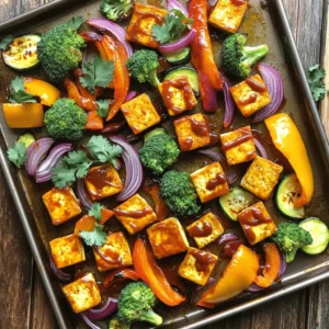 - 1 block firm tofu, pressed and cut into cubes - 1 cup barbecue sauce, store-bought or homemade - 2 bell peppers, sliced into strips - 1 medium red onion, thinly sliced - 2 cups broccoli florets, fresh or frozen - 1 medium zucchini, sliced into half-moons - 3 tablespoons extra virgin olive oil - 1 teaspoon onion powder - 1 teaspoon smoked paprika - Salt and freshly ground black pepper to taste - Fresh cilantro or parsley, chopped, for garnish First, set your oven to 400°F (200°C). This heat gets the oven ready for roasting. Good heat makes all the difference. Next, grab a large mixing bowl for the tofu. You will need to press the tofu first. This step removes extra water and helps the tofu soak up flavors. Cut the firm tofu into bite-sized cubes. In the mixing bowl, add half of your favorite barbecue sauce. Toss the tofu cubes gently until each piece is coated. Let the tofu marinate for 15 minutes. This step allows the tofu to absorb the tasty sauce. While the tofu soaks in the sauce, prepare your veggies. Take a large baking sheet and spread out the sliced bell peppers, red onion, broccoli florets, and zucchini. Drizzle the veggies with olive oil. Sprinkle with onion powder, smoked paprika, salt, and pepper. Toss the veggies with your hands or a spatula. Ensure they are well coated. Once the tofu has marinated, add it to the baking sheet with the veggies. Spread everything evenly on the sheet. Place the baking sheet in your preheated oven and bake for 25 minutes. After that time, take it out and drizzle the rest of the barbecue sauce on top. Stir gently so the sauce covers everything. Put the baking sheet back in the oven for another 15 minutes. This makes the tofu crispy and the veggies tender. When ready, remove it from the oven and let it cool for a few minutes. Enjoy your warm dish with some fresh cilantro or parsley on top! To get veggies that are soft yet crisp, follow these tips: - Cut them evenly: Aim for similar sizes. This helps them cook at the same rate. - Don’t overcrowd the pan: Leave space between veggies. This allows hot air to move around. - Use high heat: Roasting at 400°F (200°C) makes them caramelize nicely. For tofu that is crispy on the outside, do this: - Press the tofu: Remove as much water as possible. This helps it soak up the sauce and get crispy. - Marinate well: Coat the tofu in BBQ sauce for at least 15 minutes. This adds flavor and aids in browning. - Spread out the tofu: Place it in a single layer on the sheet. This ensures even cooking and crispiness. Choosing the right BBQ sauce makes a big difference. Here are some ideas: - St. Louis Style: Sweet and tangy, great for a classic taste. - Texas Style: Spicy and bold, perfect for those who like heat. - Homemade BBQ Sauce: Mix ketchup, vinegar, brown sugar, and spices for a quick sauce. Experiment with your favorite flavors to find the perfect match! {{image_4}} If you want to mix things up, try using tempeh or seitan. These proteins have different textures and flavors. Tempeh is nutty and chewy, while seitan is very meaty. Both absorb flavors well. Adjust the cook time based on the protein you choose. For example, tempeh may need a bit more marinating time. Feel free to play with the veggies! Carrots, sweet potatoes, or Brussels sprouts work great. You can also add green beans or asparagus for a seasonal twist. Just remember to cut them into similar sizes. This helps them cook evenly. Try mixing colors for a vibrant dish that looks as good as it tastes. You have many options for BBQ sauce. Look for a vegan brand that you love. If you want to make your own, combine ketchup, apple cider vinegar, and maple syrup. Spice it up with garlic powder or smoked paprika. Making your own sauce allows you to control the sweetness and spice levels. To store leftovers, let the dish cool down first. Then, place it in an airtight container. Make sure to store the tofu and veggies together for the best flavor. Keep it in the fridge for up to three days. If you want to keep it longer, consider freezing. To reheat, use the oven for the best taste. Preheat your oven to 350°F (175°C). Spread the tofu and veggies on a baking sheet. Heat for about 10-15 minutes or until warm. You can also use a microwave, but the oven keeps the texture better. You can freeze this dish, but it's best to freeze the tofu and veggies separately. Place them in freezer bags or airtight containers. They will stay fresh for up to three months. To enjoy, thaw in the fridge overnight before reheating. Yes, you can use different types of tofu. I recommend using firm or extra-firm tofu. Silken tofu may not hold its shape when baked. If you prefer a softer texture, try soft tofu. Just remember to adjust your cooking time. You want the tofu to be nicely crispy on the edges. You can swap in many veggies. For example, carrots, sweet potatoes, or asparagus work well. Cauliflower or Brussels sprouts add a nice touch too. Just keep your cooking times in mind. Some veggies cook faster than others. To make this dish gluten-free, use a gluten-free barbecue sauce. Many brands offer great options. Also, check if your tofu is gluten-free. Most firm tofu is safe, but it’s good to double-check. Yes, you can prepare this dish ahead of time. Marinate the tofu a day before and store it in the fridge. You can also chop the veggies in advance. Just keep them in an airtight container. When you're ready, bake everything together for a quick meal. BBQ tofu with roasted veggies brings great flavor and fun. You learned key ingredients, steps, and helpful tips to make it delicious. Now you can get creative with variations and enjoy leftovers easily. This dish is healthy, tasty, and simple to prepare. Experiment with your favorite veggies and sauces. Enjoy each bite knowing you made a great meal!